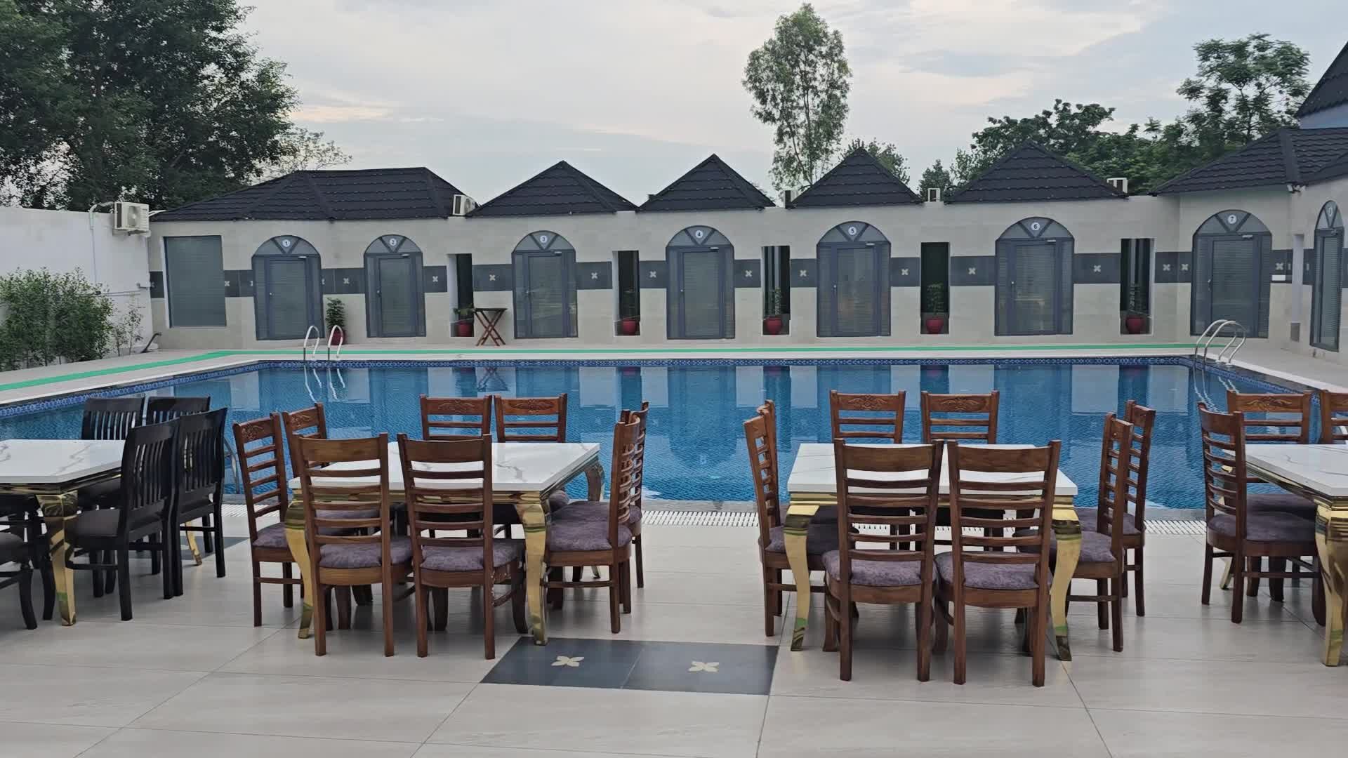 Pool deck with dining tables, La Aqua